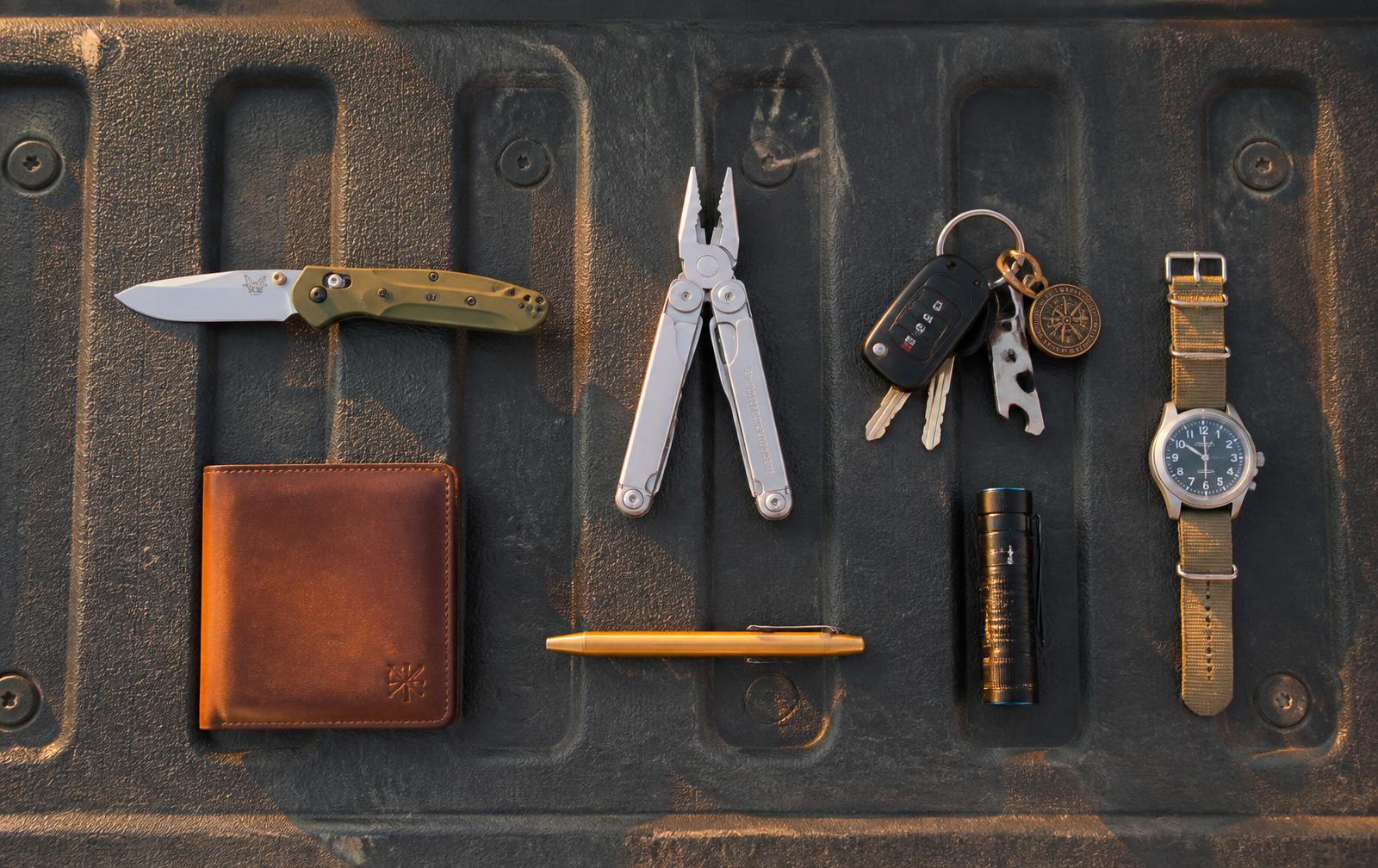 Everyday carry laid out on a truck tailgate